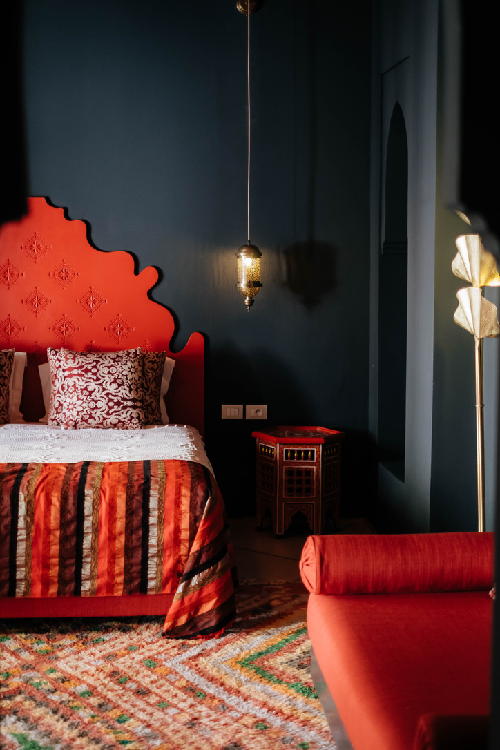 Intimate seating area in Moroccan comfort room with traditional cushions, low table, warm ambiance, authentic decor