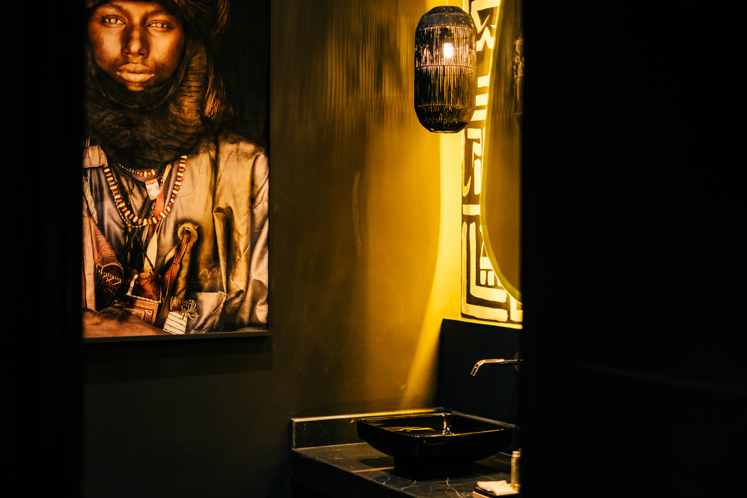 A serene Moroccan courtyard garden with a central fountain