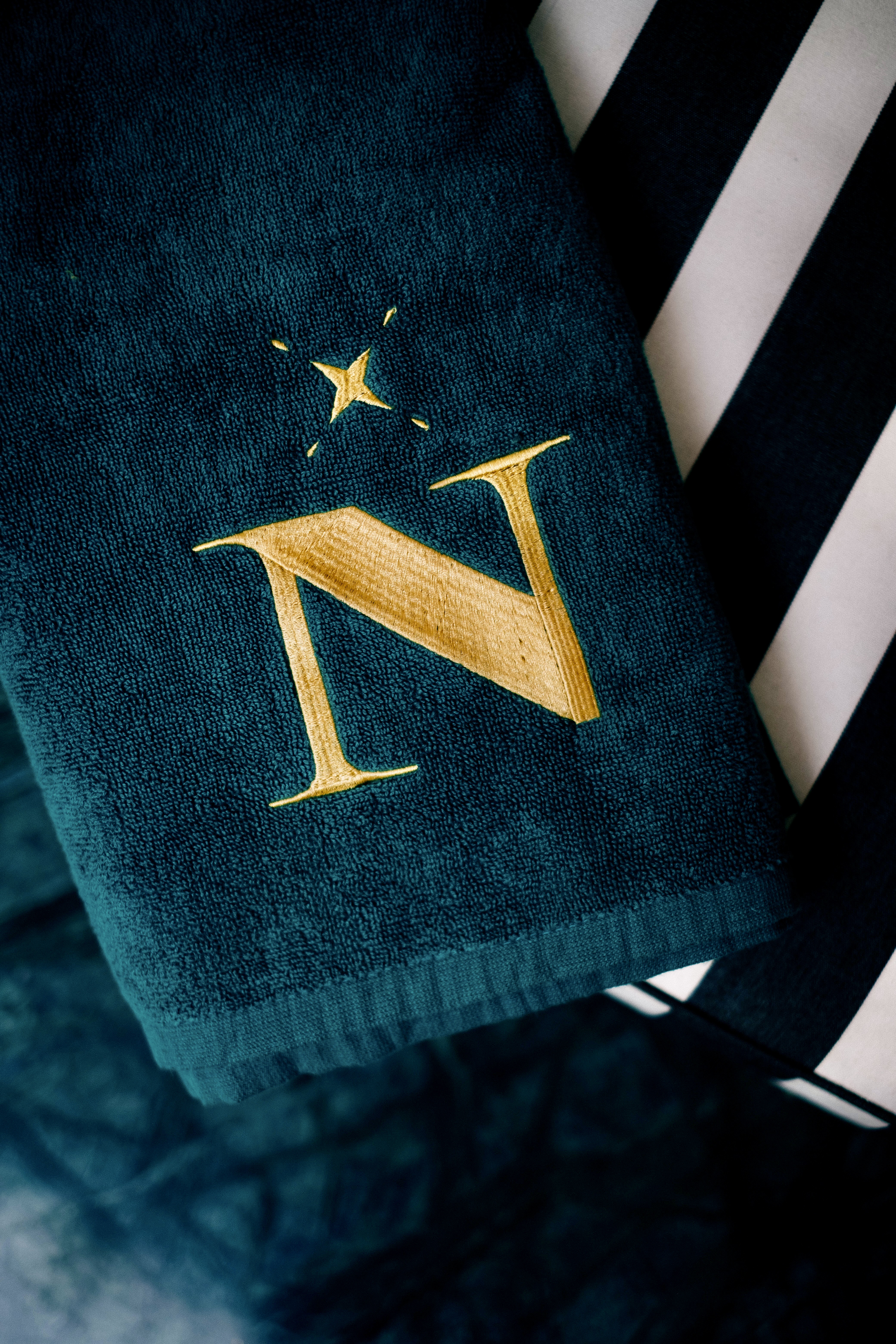 Elegant Moroccan bedroom with a four-poster bed, dark wood paneling, and sophisticated decor, warm and intimate