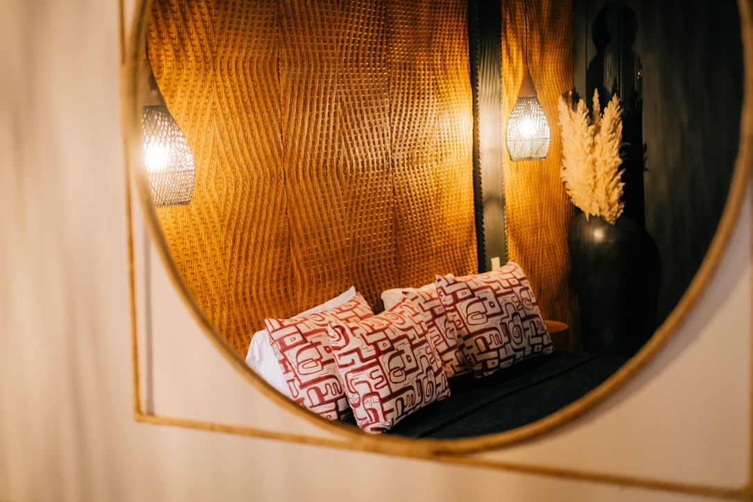 Traditional Moroccan tadelakt bathroom with Italian shower, natural stone, warm lighting, luxury hotel amenities
